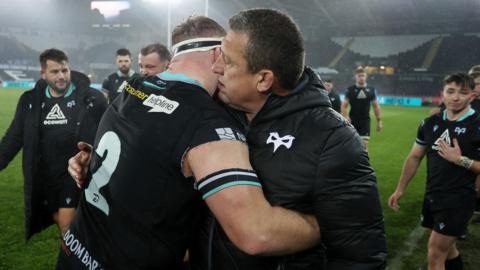 Dewi Lake and Toby Booth embrace after Ospreys defeated Scarlets in December 2023