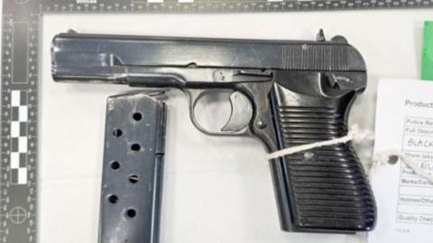 A handgun with bullet clip detached