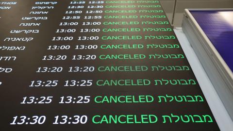 A departure board at Ben Gurion airport in Tel Aviv shows cancelled flights.