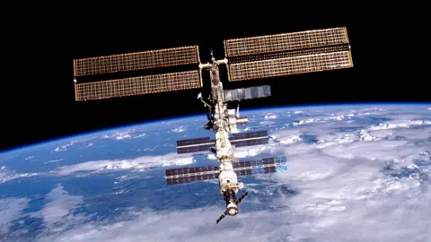 The International Space Station floats above Earth.