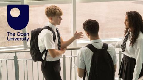 The Open University logo at the top left of an image of three teenagers in school.