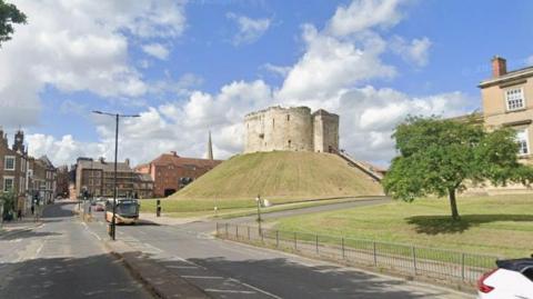 General view of Tower Street in York, with Clifford's Tower in the background.