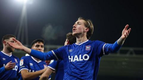 Ipswich Town's Jack Clarke celebrates his goal against Bristol City as teammates rush to join him.