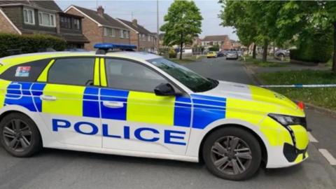 A police car in the Summertrees Road area of Ellesmere Port