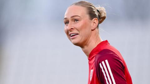 Rhiannon Roberts smiles during pre-match of a Wales game