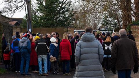 People on a walking tour in Duxford