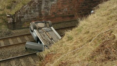 Car on railway line in Brampton