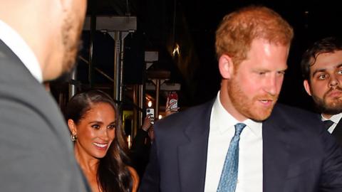 Prince Harry and Meghan leaving New York awards ceremony