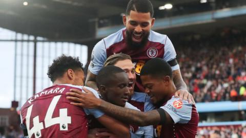 Aston Villa players celebrate scoring against Luton