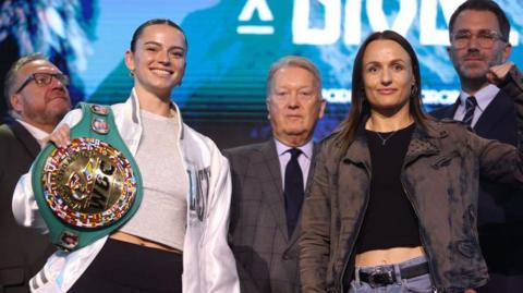 Skye Nicolson and Raven Chapman pose for photos at a news conference alongside promoters Eddie Hearn and Frank Warren