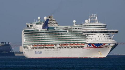 MV Ventura, a 116,017 GT Grand-class cruise ship of the P&O Cruises fleet, pulls away from port in the water