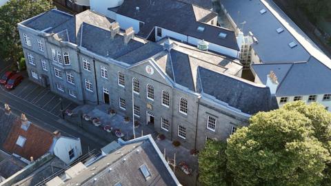 An aerial view of a government building in Guernsey.