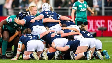 Ireland and Scotland players contest a scrum during the Women's Six Nations Rugby Championship match