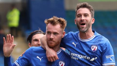 Chesterfield's Tom Naylor (L) celebrates with team-mate Will Grigg