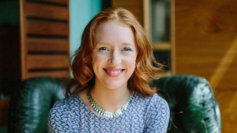 Finance Expert, Iona Bain smiling looking directly at the camera wearing a blue dress.