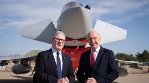 Sir Keir Starmer and John Healey in Ankara in front of a UK Typhoon jet on 27 October 2025