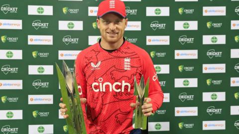 England captain Jos Buttler with the T20 series trophy and player of the series trophy