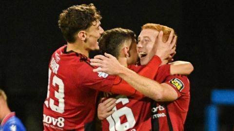Jarlath O'Rourke (right) celebrates making it 2-0 for Crusaders against Linfield