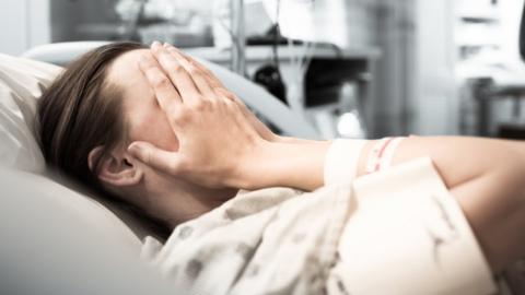 Woman in hospital bed