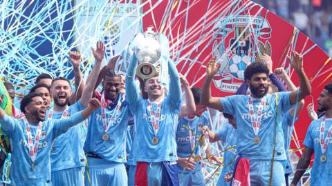 Coventry players lifted the Championship trophy after beating Wrexham