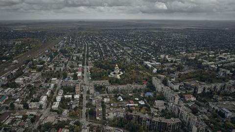 A general aerial view shows the destroyed city covered in morning fog, following months of intense fighting near the front line, on October 7, 2025 in Pokrovsk