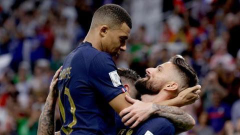 Mbappe hugs Giroud