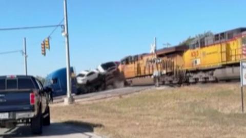 A train is colliding with an 18-wheeler in Texas.