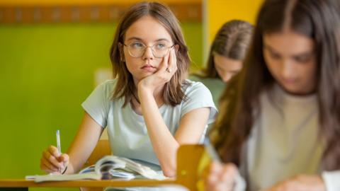 Teenage girl in a clqssroom