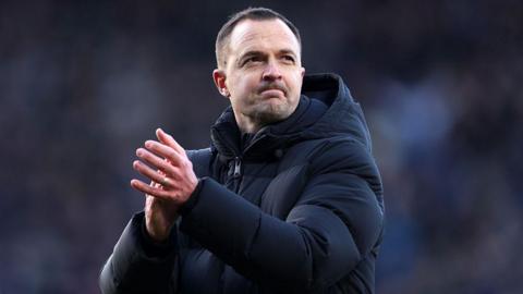 Birmingham City manager Chris Davies applauds fans after their home draw with Derby on Boxing Day