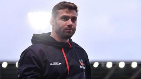 Leigh Halfpenny wearing a training top looks into the distance