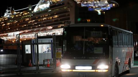 A bus carrying British passengers from the Diamond Princess Cruise ship