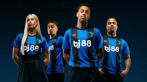 An image of four Bournemouth players wearing the blue and black stripes