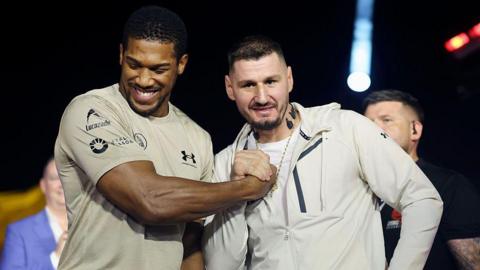 Anthony Joshua and Kristian Prenga shake hands