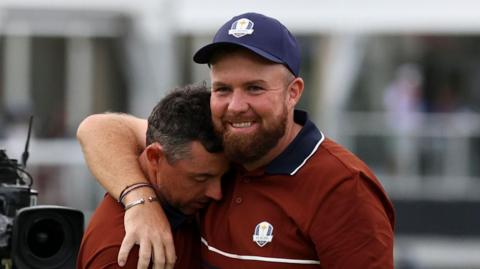 Rory McIlroy and Shane Lowry embrace after Ryder Cup win on Saturday