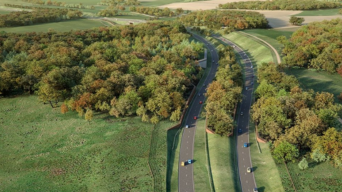 An image provided by Norfolk County Council showing how a section of the Western Link could look. It shows a number of cars on two curving lanes running through the countryside, with a mixture of fields and trees surrounding them.