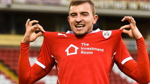 Michal Helik celebrates scoring a goal for Barnsley