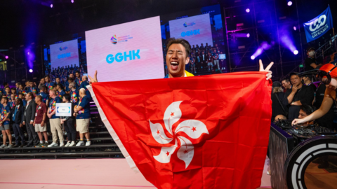 A Gay Games participant holds up the Hong Kong flag while celebrating the opening ceremony of the Games in Hong Kong last weekend