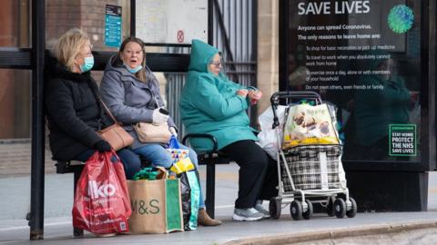 People at bus stop