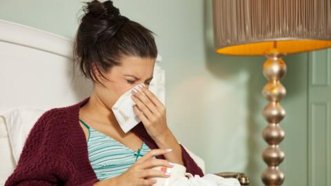 Stock image of woman with a cold