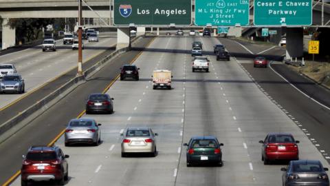 Cars travel north towards Los Angeles on interstate highway 5 in San Diego, California February 10, 2016