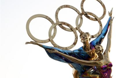 A sculpture depicts Olympic figure skaters for the 2022 Beijing Winter Olympics