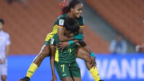 Gabrielle Onguene of Cameroon celebrates with Jeannette Yango after scoring a goal