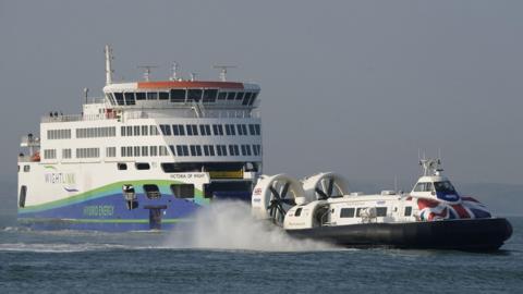 File photo dated 25/03/22 of The Hovertravel hover craft 'Island Flyer' (right) passing the Wightlink ferry Victoria of Wight as they both make their way towards Portsmouth from the Isle of Wight.