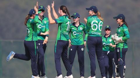 A group of Ireland players celebrate their win over the Netherlands in Nepal