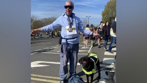 A man and his assistance dog. 