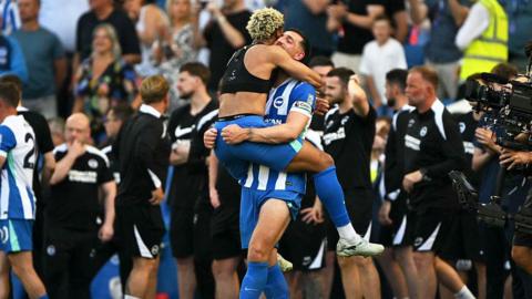 Brighton players Georginio Rutter and Lewis Dunk celebrate after securing European football