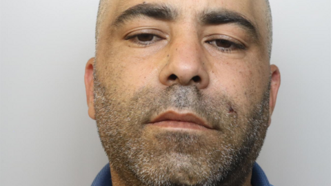 Sid Ali Djelid has a shaved head and dark stubble with specs of grey