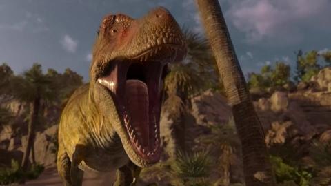  CGI dinosaur stands in a landscape with rocks and palm trees. Its mouth is wide open as if it's roaring.