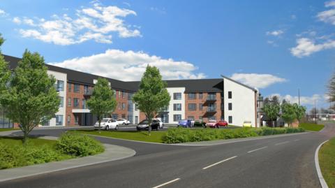 A CGI image shows what one of the buildings might look like. It is three-storey and T- shaped, with sections of white render between brown brick walls. The area in front of the building contains a ground level car park and manicured lawns with a few trees and low bushes. A road runs past the building into the distance.
