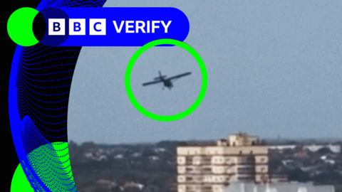 A drone - ringed in green - about to hit an apartment block in Rostov, Russia